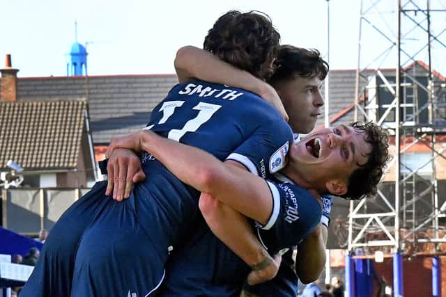 Reece Smith celebrates his equaliser against Tranmere with Isaac Moore.