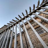 Metal spikes and razor wire at a prison