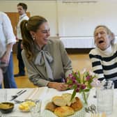 The Princess of Wales laughs with Lynda Jones, 74, during a visit to the West Sussex Minibus Service, a volunteer-led community transport organisation
