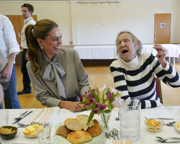 The Princess of Wales laughs with Lynda Jones, 74, during a visit to the West Sussex Minibus Service, a volunteer-led community transport organisation
