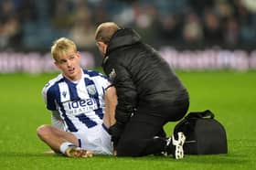 Toby Collyer receiving treatment in Albion's clash against Birmingham City in what transpired to be the final game of his loan.