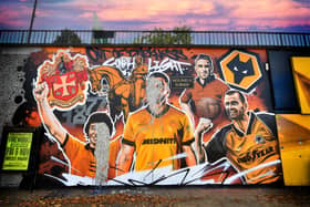 Two week son and the Wolves mural is still in need of repair after being vandalised.
Tim Thursfield/Iconic Media Group