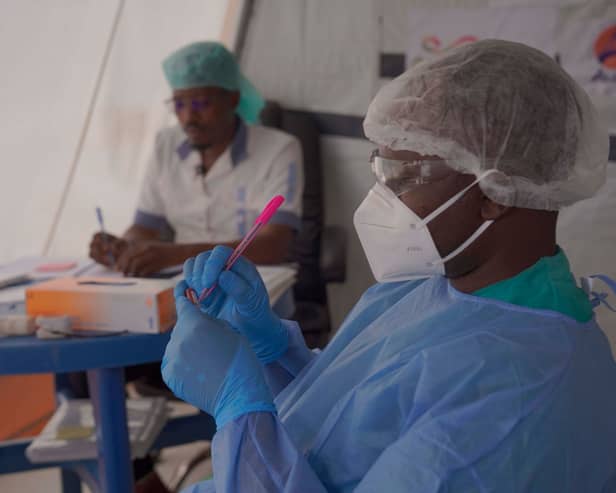 Clinicians prepare samples