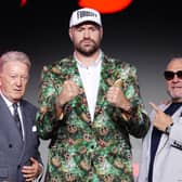 Tyson Fury (centre), his manager Spencer Brown (right) and promoter Frank Warren