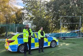 A police cordon around woodland close to the cricket club in Elmley Castle, Worcestershire