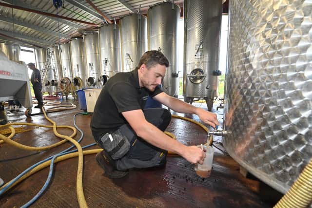 The winery at Halfpenny Green Wine Estate. Keeping an eye on the tanks is Ben Hunt
