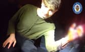 Screenshot taken from police body worn video of forensics student Benjamin Day as he was treated for a hand injury by officers in Dudley, 
