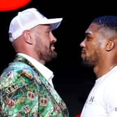 Tyson Fury (left) and Anthony Joshua face off following a press conference
