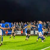 Elation! Stafford Rangers players celebrate their late winner against Halesowen Town. Pic: Pete Wideman
