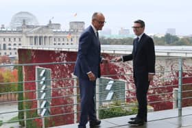 Friedrich Merz, left, and Andy Burnham