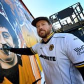 Artist Joe Miles has repaired his incredible Wolves mural after it was vandalised.

