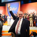 Ed Davey waves as he leaves the stage at the Lib Dem party conference