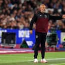 West Ham manager Nuno Espirito Santo gestures with his left arm outstretched on the touchline against QPR