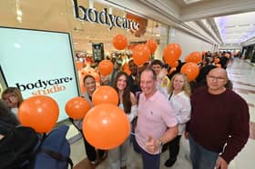  Richard Hyde, from Dudley, is among delighted shoppers queuing at the re-opened Bodycare branch at Merry Hill Shopping Centre