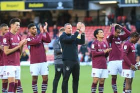 Burnley manager Nicky Hayen and players applaud the fans