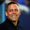Reading boss Leam Richardson smiles in the dugout