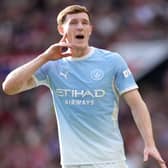 Manchester City’s Elliot Anderson presses a finger close to his ear