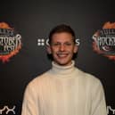 Freddy Brazier smiling at a premiere