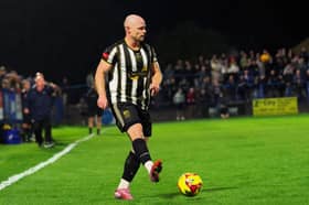 Tom Tonks on the ball for Stafford Rangers against Halesowen Town in the FA Cup