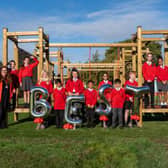 Celebrating their Ofsted success are D’Eyncourt Primary School pupils with, left, Headteacher Danielle Darby and, right, Councillor Jacqui Coogan, Cabinet Member for Children, Young People and Education