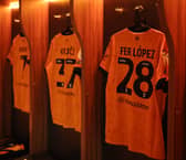 Wolves shirts hanging in the dressing room