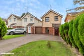 A block-paved driveway, manicured lawn and large garage give this detached Wolverhampton property a practical approach, with parking for multiple vehicles