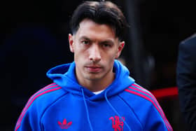 A scowling Lisandro Martinez arrives for a Manchester United match