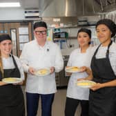 Summer Osbourne, Mayor Richard Parker, Maya Amir, and Amia Fishley taking part in an omelette making challenge. PIC: WMCA