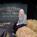 The new Peaky Blinders tour at Black Country Living Museum.
Reporter Emma Hynes sits next to the gates used in the Peaky Blinders series.
Tim Thursfield/Iconic Media Group


