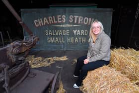 The new Peaky Blinders tour at Black Country Living Museum.
Reporter Emma Hynes sits next to the gates used in the Peaky Blinders series.
Tim Thursfield/Iconic Media Group

