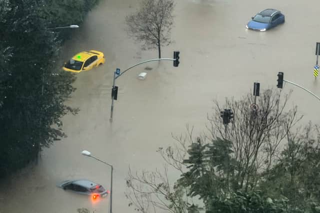 Vehicles are stranded on a partially flooded highway during heavy rain in Istanbul, Turkey (Egecan Ozguner/AP)