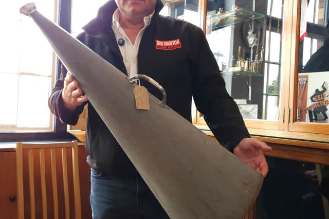 Dik Barton holds a replica of an Acme Stentor megaphone similar to the one used by Captain Smith