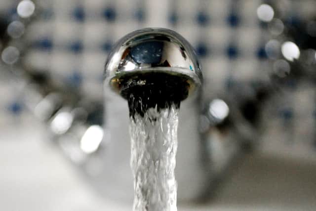 Water coming out of a tap