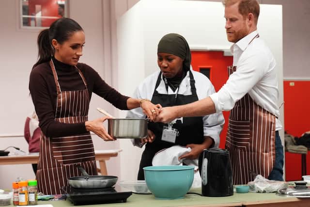 The Duke and Duchess of Sussex helped with the cooking (Annabel Lee-Ellis/PA)