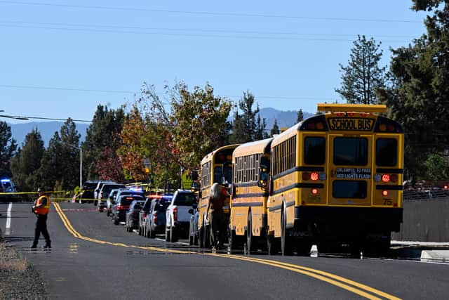 School buses are lined up outside Silver Rail Elementary school, where a shooting took place (Joe Kline/AP)
