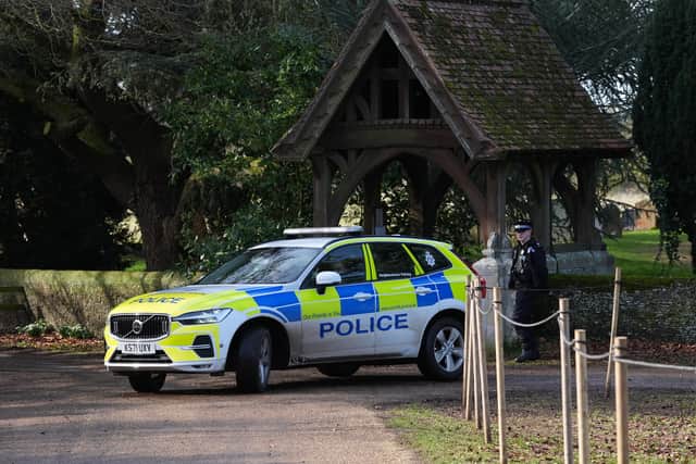 A police car at the entrance to he Sandringham Estate in Norfolk (Gareth Fuller/PA)