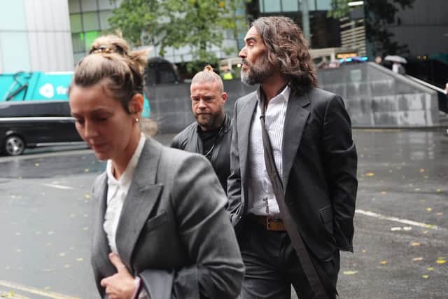 Russell Brand, accompanied by his wife Laura Gallacher, arriving at Southwark Crown Court (Jonathan Brady/PA)