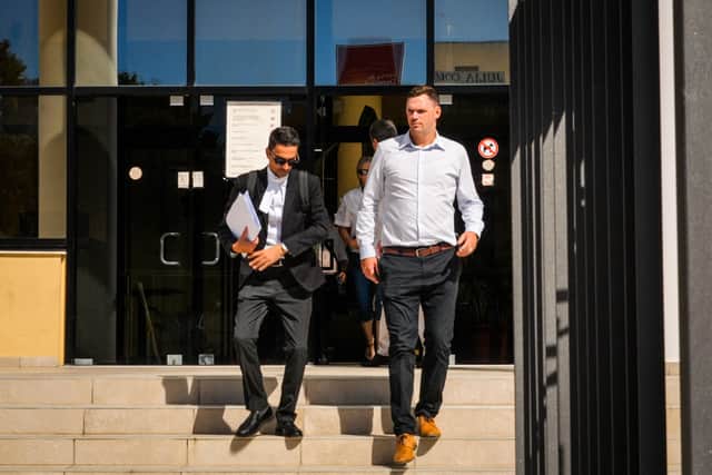 Joshua Foster (right) with his lawyer Alexandros Alexandrou leaving Paphos District Court (Ed Lawrence/PA)