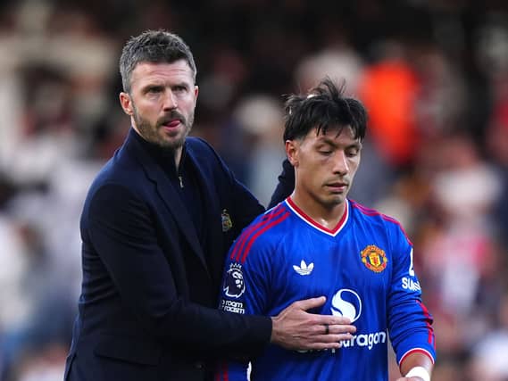 Manchester United manager Michael Carrick with Lisandro Martinez