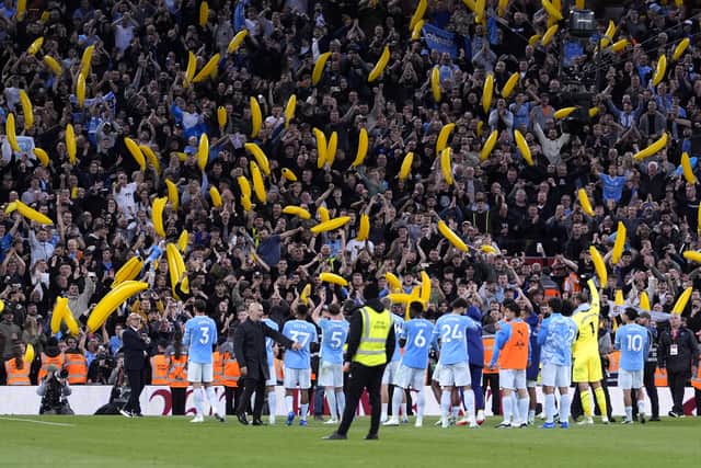 Manchester City celebrate victory at Anfield (Peter Byrne/PA).