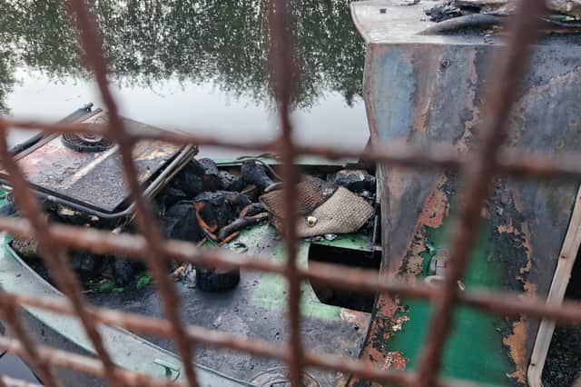 The boat was left burnt out, with damage visible on the outside