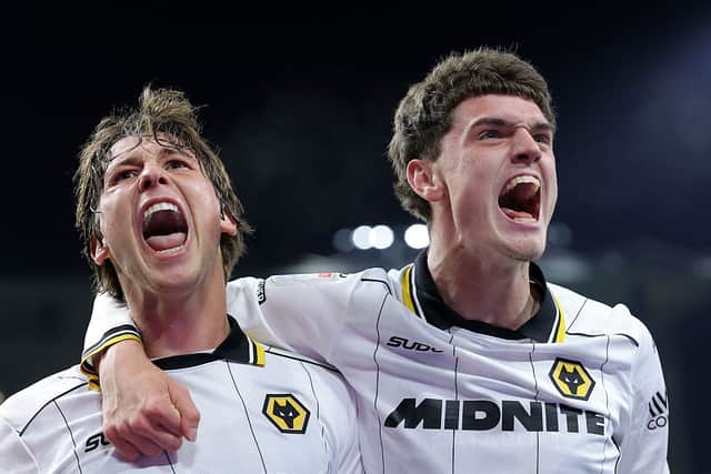 Fer Lopez (left) celebrates with Sean Neave after firing Wolves level at Burnley