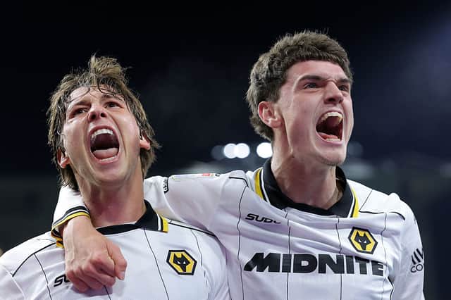 Fer Lopez (left) celebrates with Sean Neave after firing Wolves level at Burnley