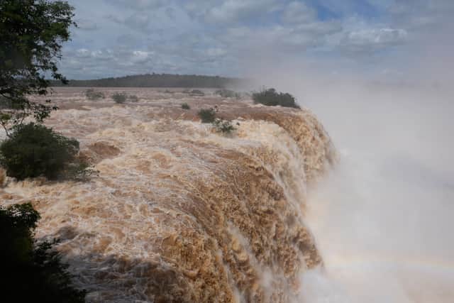 Water cascades over the cliffs of Iguazu Falls (Jorge Saenz/AP)