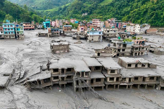 Buildings deluged in sludge in Devighat in Nepal's Nuwakot district after flash floods hit the area in August. More than 1,400 bodies have been found and thousands more are still missing. Picture: Prabin Ranabhat