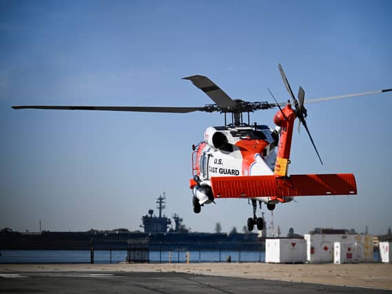 A US Coast Guard helicopter lifts off at Coast Guard Station San Diego
