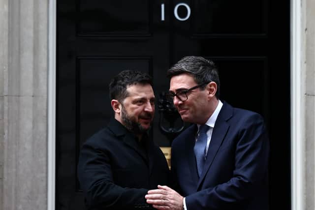 Volodymyr Zelensky shakes hands with Andy Burnham outside 10 Downing Street