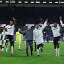 Wolves players celebrate their comeback win over Burnley