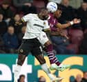 Wolves defender Ghislain Konan (left) battles with Burnley’s Largie Ramazani for the ball