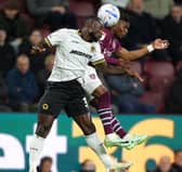 Wolves defender Ghislain Konan (left) battles with Burnley’s Largie Ramazani for the ball